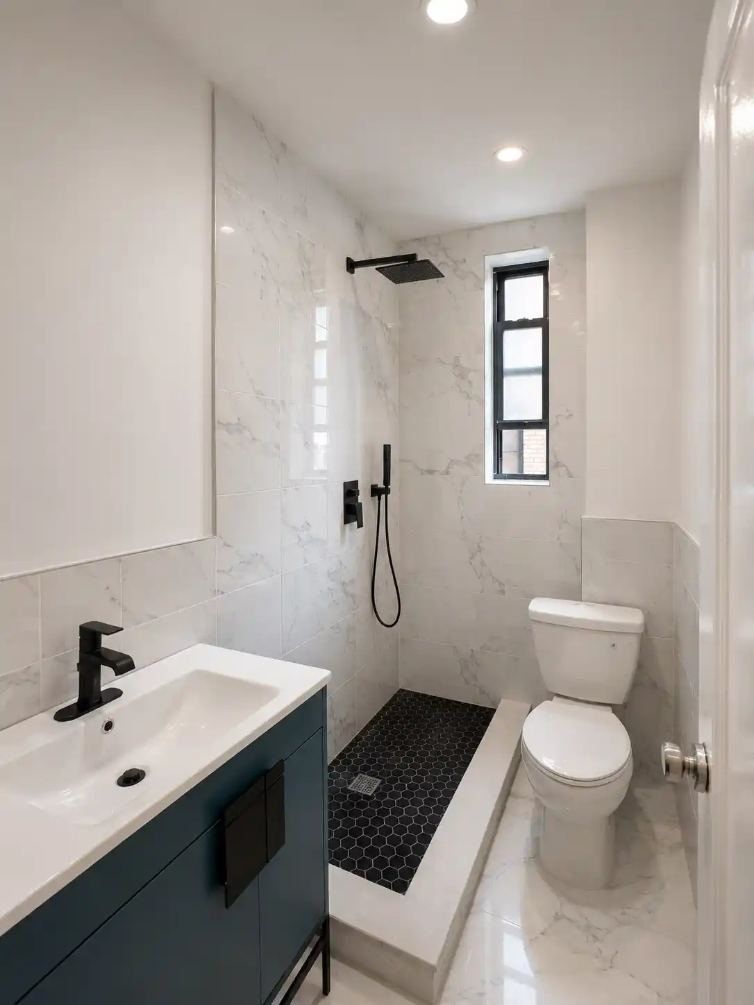 Completed bathroom renovation featuring compact shower with black fixtures