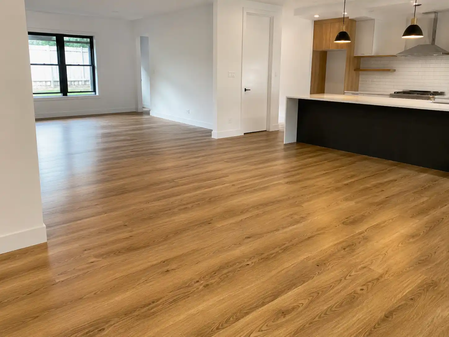 Completed flooring and finishing project featuring open-plan flooring installation