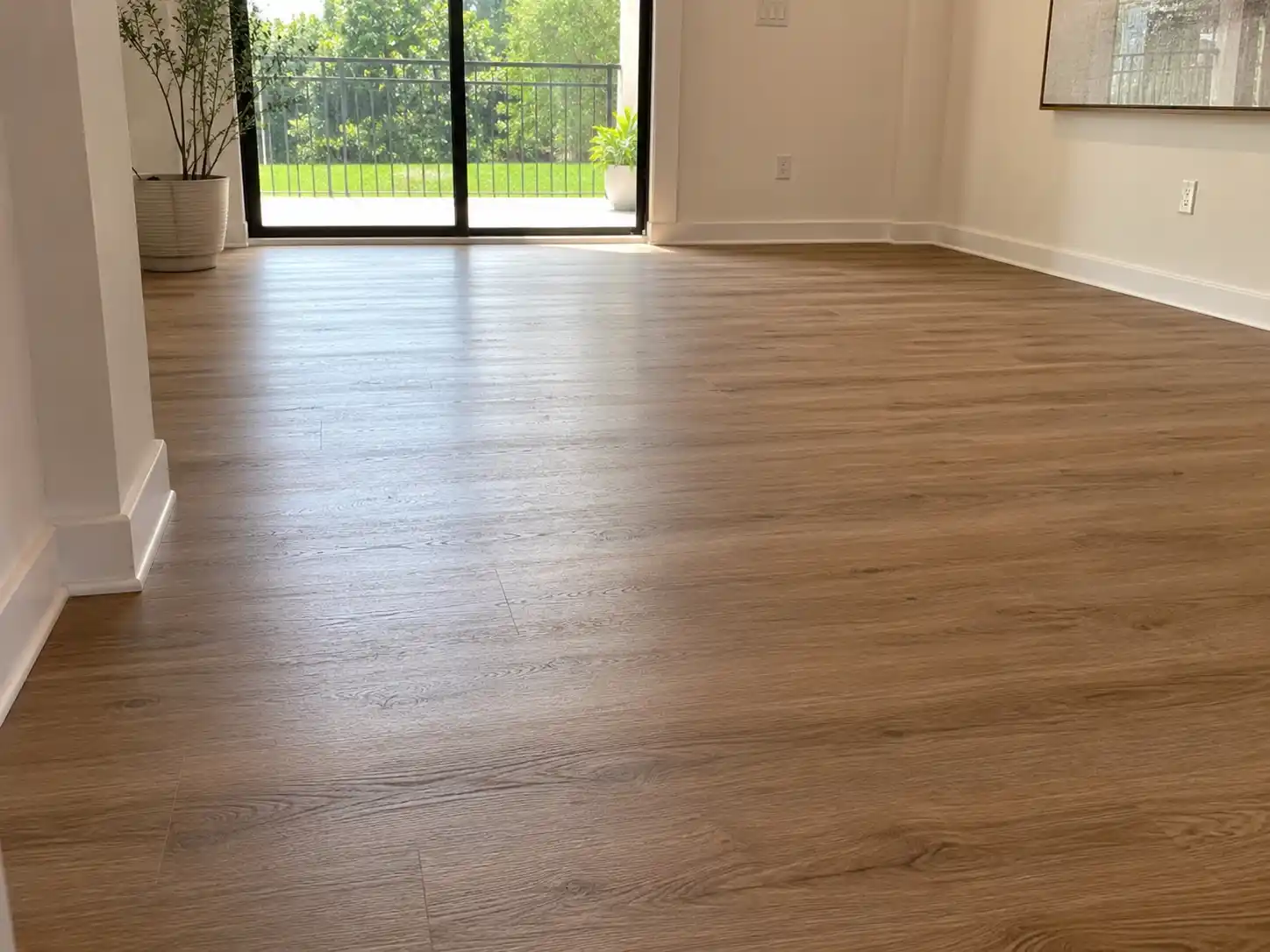 Completed flooring and finishing project featuring garden-facing living room flooring