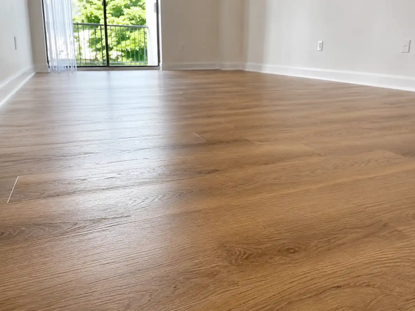 Completed flooring and finishing project featuring wood-look flooring detail