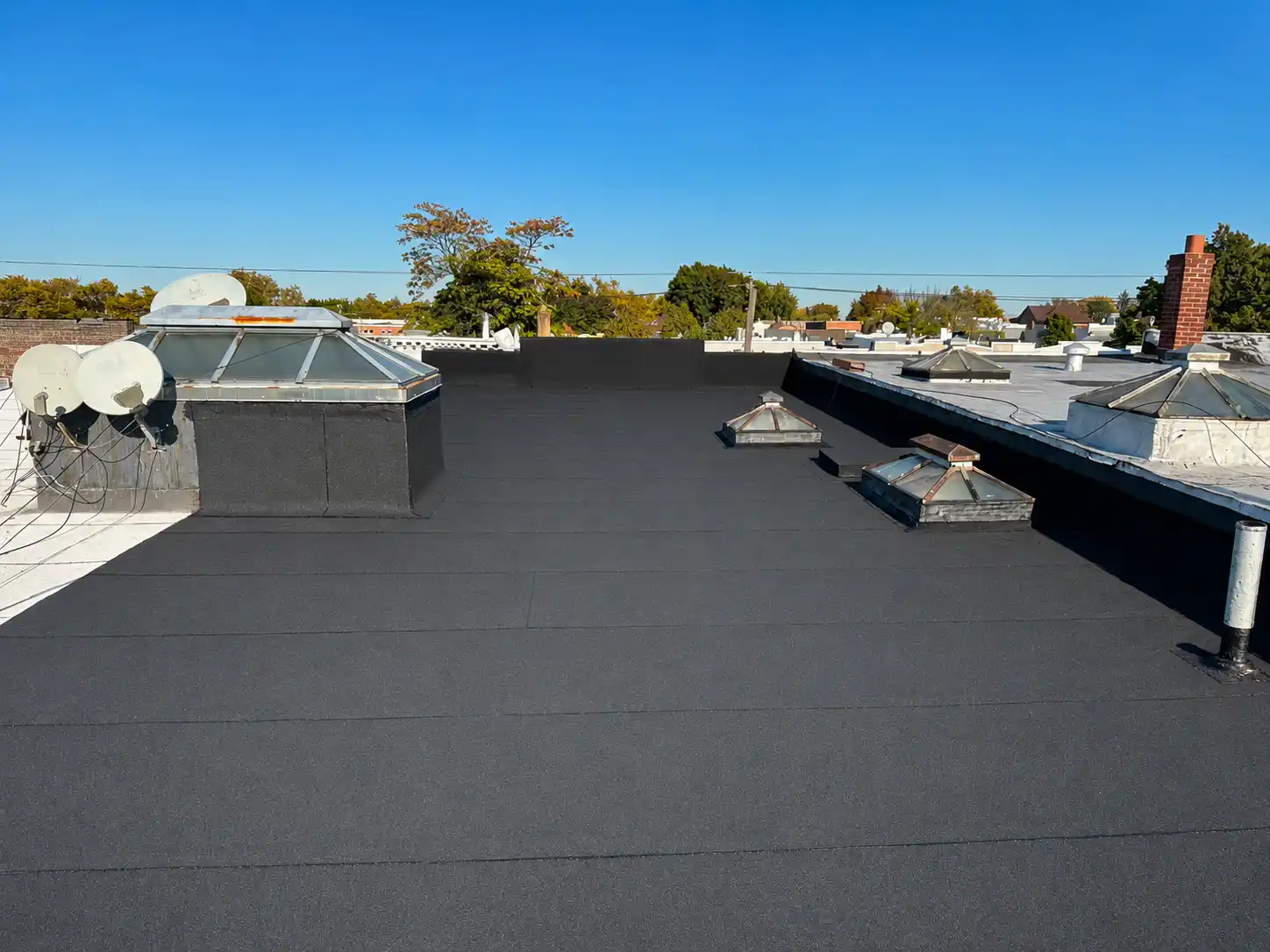 Completed roofing project featuring roof edge & gutter detail